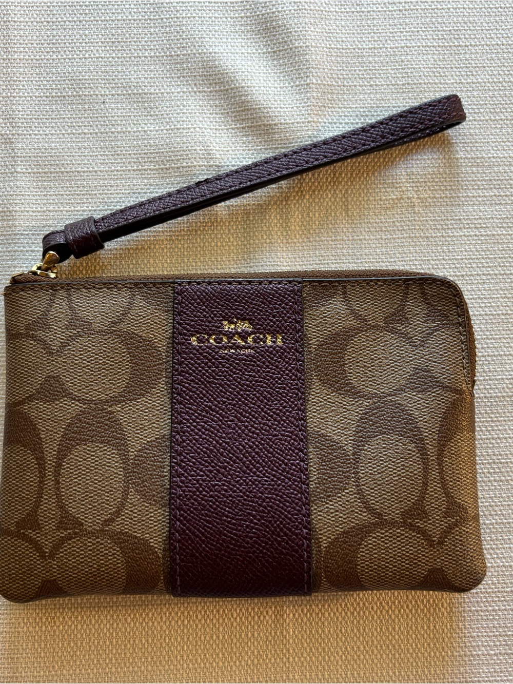 Coach Brown Signature Canvas Wristlet with Plum Stripe